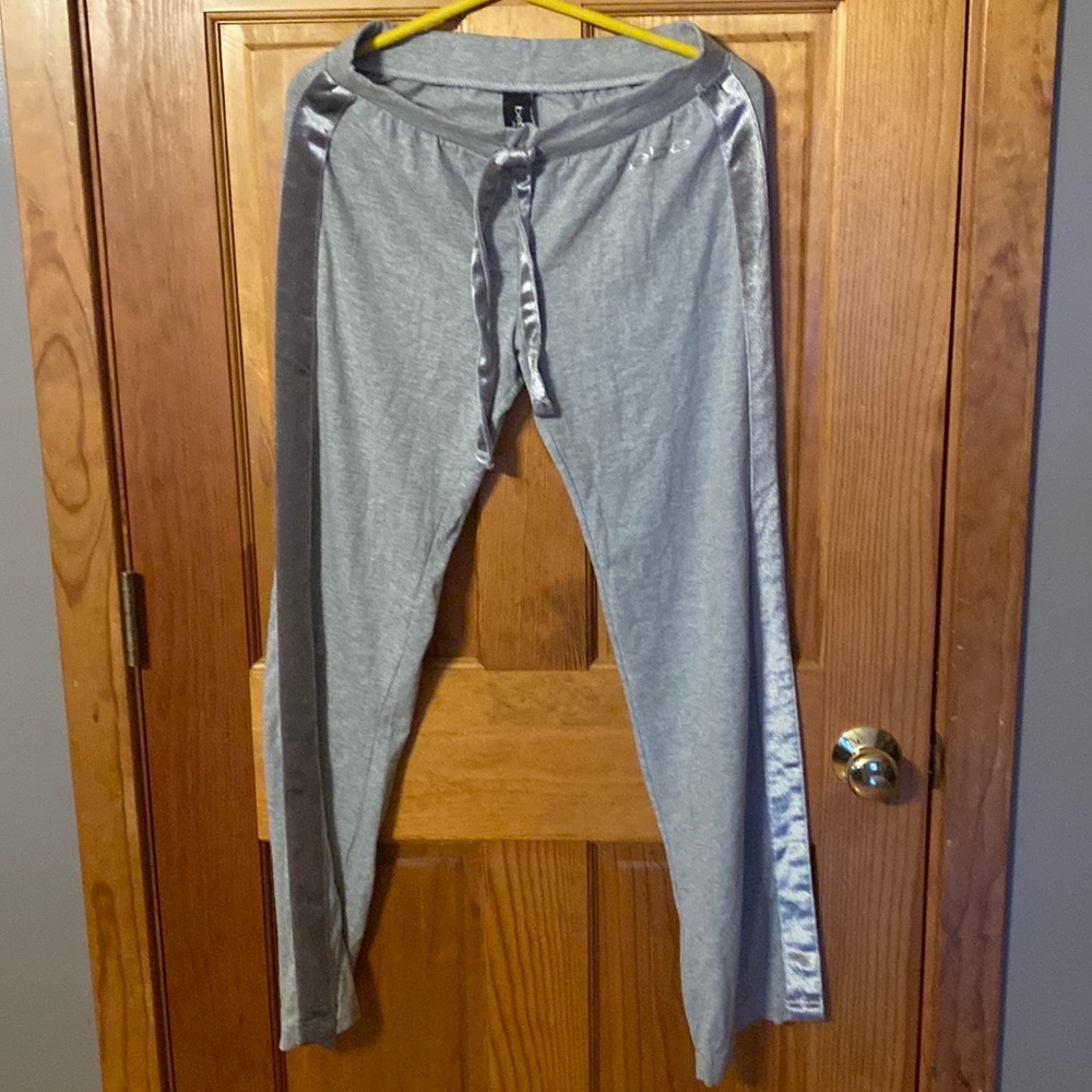 bebe sweatpants… Gray with velour stipe on side of legs / Velour tie at waist .